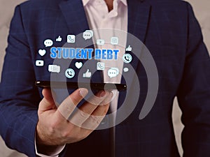 STUDENT DEBT text in search bar. Businessman looking at cellphone. Student debtÂ refers to loans used to pay for college tuition